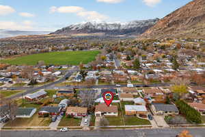 Aerial perspective of neighborhood with a mountain backdrop