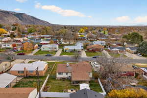 Aerial perspective of neighborhood with a mountain backdrop