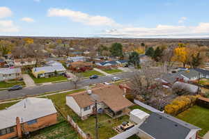Aerial perspective of neighborhood with a mountain backdrop