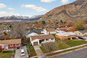 Aerial perspective of neighborhood with a mountain backdrop