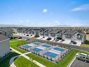 Aerial perspective of suburban area featuring a mountainous background