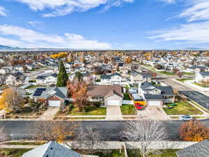 Aerial view of residential area featuring a mountainous background