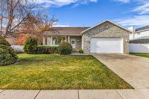 Single story home featuring driveway, brick siding, an attached garage, and a shingled roof