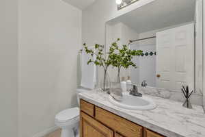 Bathroom with vanity and a shower