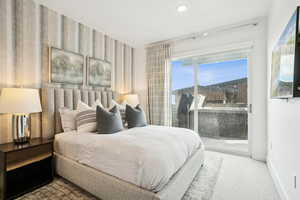 Bedroom featuring carpet floors, access to outside, wallpapered walls, and recessed lighting
