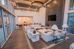 Common area featuring wooden ceiling, a towering ceiling, and recessed lighting