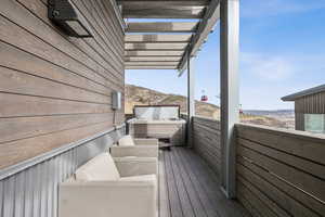 Wooden deck featuring a mountain view