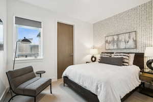 Bedroom with carpet and baseboards