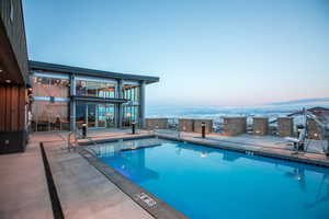 Community pool with a patio area