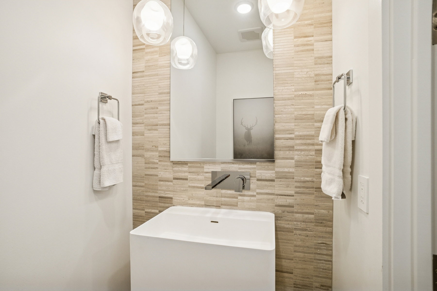 Bathroom with tile walls and vanity