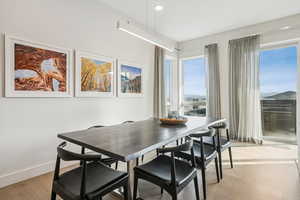 Dining room featuring light wood finished floors and recessed lighting