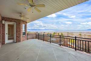View of patio featuring a mountain view and ceiling fan