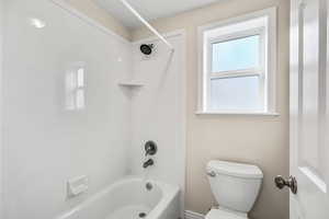 Bathroom featuring  shower combination and toilet