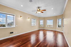 Master Suite featuring crown molding, wood finished floors, a ceiling fan, and recessed lighting
