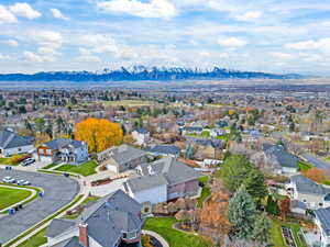 Aerial view of residential area with a mountainous background