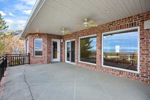 View of patio featuring ceiling fan and a mountain view