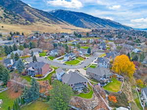 View of property location featuring nearby suburban area and a mountain backdrop