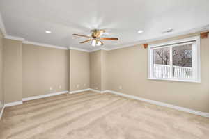 Empty room featuring crown molding, light carpet, ceiling fan, and recessed lighting