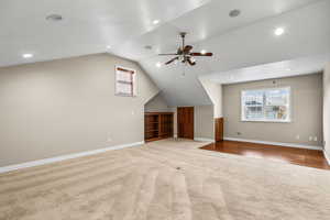 Bonus room featuring light carpet, vaulted ceiling, recessed lighting, and a ceiling fan