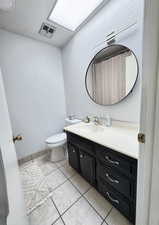 Bathroom featuring vanity and light tile patterned floors
