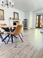 Dining room featuring a chandelier and light wood-style floors