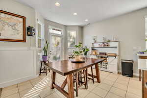 Dining area featuring recessed lighting and light tile patterned flooring