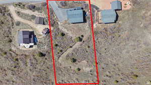 Aerial view of property's location with property boundaries highlighted and rural landscape