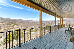 Wooden terrace featuring a mountain view