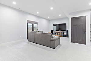 Living room featuring light carpet and recessed lighting