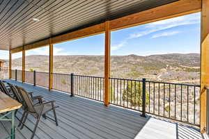 Wooden terrace featuring a mountain view