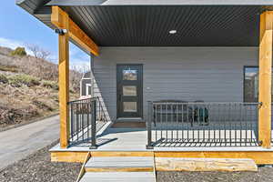 Property entrance with covered porch