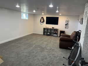 Exercise area with carpet floors and recessed lighting