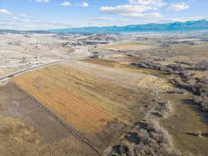 Aerial view of sparsely populated area featuring a mountain backdrop