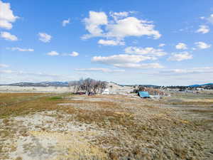 View of yard with a mountain view and a view of countryside