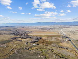 View of property location featuring a mountain backdrop and rural landscape