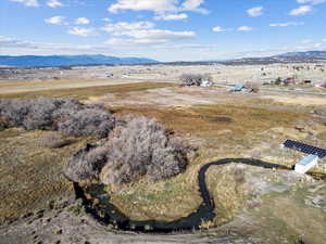 View of property location with a mountain backdrop and rural landscape