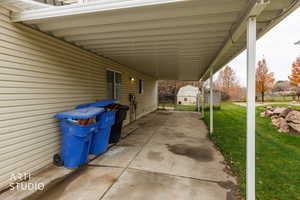 View of patio featuring a shed