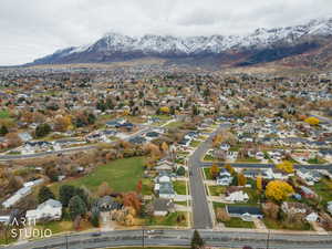 View of property location with a mountain backdrop and nearby suburban area