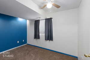 Spare room with carpet, a textured ceiling, and ceiling fan