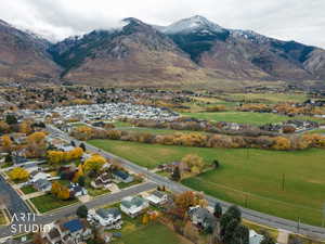 Aerial perspective of suburban area featuring a mountainous background