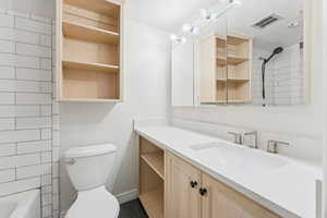 Full bathroom featuring  shower combination and vanity