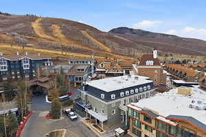 Aerial perspective of suburban area featuring a mountainous background