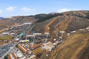 Aerial overview of property's location with a mountainous background
