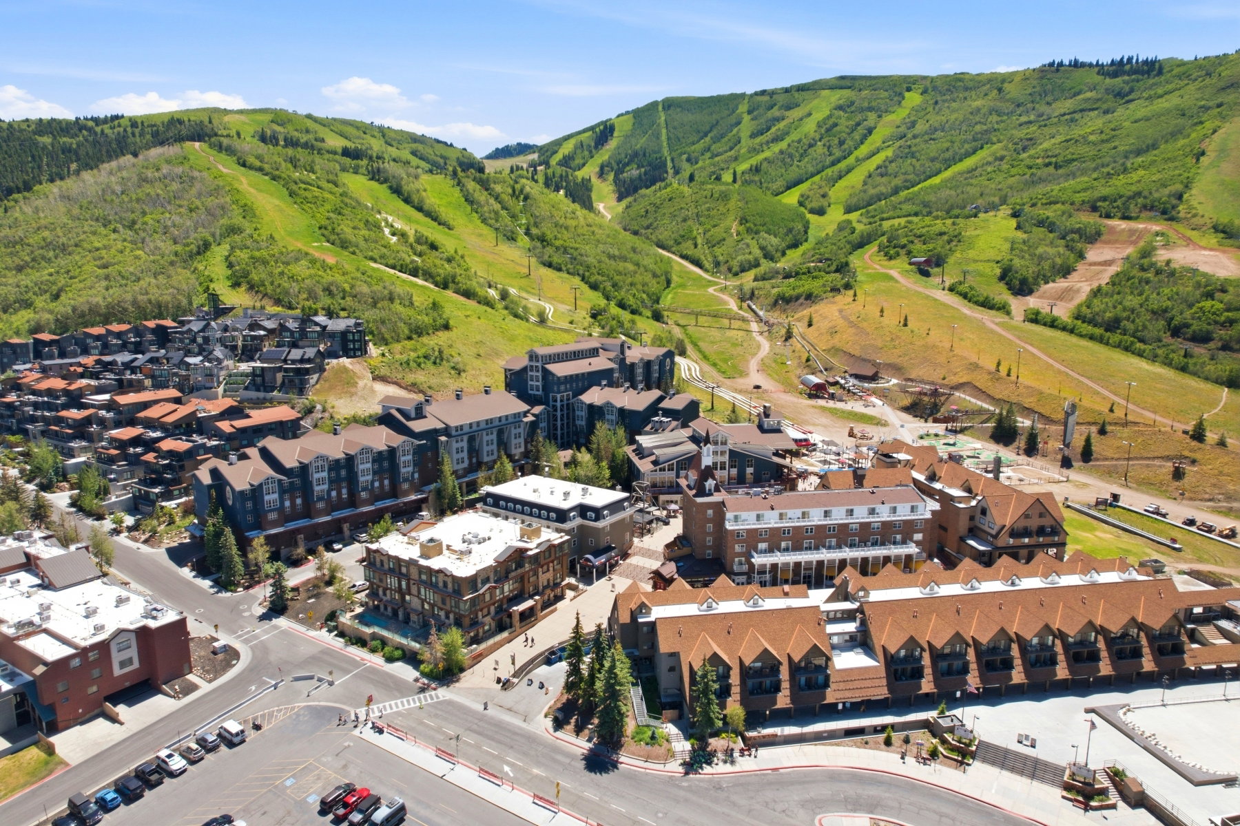 Expansive mountain landscape featuring lush green slopes