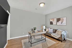 Office featuring baseboards and light wood-style floors