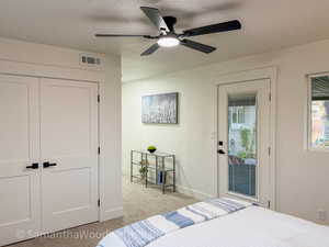 Primary Bedroom Carpeted bedroom with access to exterior, a closet, and ceiling fan