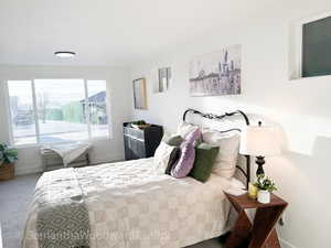 Bedroom with baseboards and carpet flooring