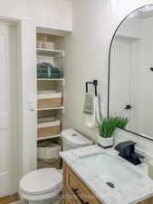 Bathroom with vanity and toilet