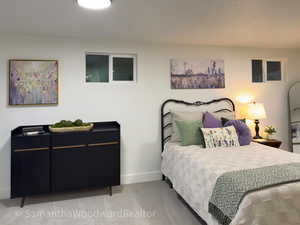 Carpeted bedroom with baseboards