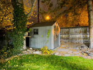 View of shed featuring a fenced backyard